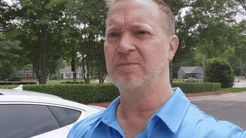 Auto dealer recording a personalized car walkaround video